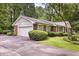 Single-story home with a brick facade, white trim, and an attached two-car garage at 3792 Harts Mill Ne Ln, Brookhaven, GA 30319