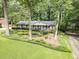 Charming one-story home with well-manicured landscaping, lush greenery, and a welcoming front entrance at 3792 Harts Mill Ne Ln, Brookhaven, GA 30319