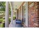 Inviting covered front porch, complete with seating, provides a relaxing outdoor space at 3792 Harts Mill Ne Ln, Brookhaven, GA 30319