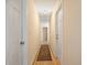 Hallway with wood floors and a neutral colored rug at 3792 Harts Mill Ne Ln, Brookhaven, GA 30319
