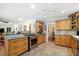 Spacious kitchen featuring stainless steel appliances, tile flooring, and light wood cabinetry at 3792 Harts Mill Ne Ln, Brookhaven, GA 30319