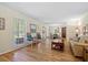 Bright living room featuring hardwood floors, ample natural light, and comfortable seating at 3792 Harts Mill Ne Ln, Brookhaven, GA 30319