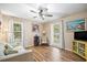 Sunlit living room with hardwood floors, bright windows, and modern decor at 3792 Harts Mill Ne Ln, Brookhaven, GA 30319