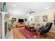Cozy living room features a fireplace, hardwood floors and comfortable seating at 3792 Harts Mill Ne Ln, Brookhaven, GA 30319