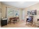 Bright home office with a wooden desk, chair, and large window at 3792 Harts Mill Ne Ln, Brookhaven, GA 30319