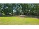 Flat backyard with a shed in the background at 4052 Keheley Glen Ne Dr, Marietta, GA 30066