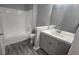 Updated bathroom with a tub and shower combination features modern fixtures and a sink vanity at 4052 Keheley Glen Ne Dr, Marietta, GA 30066