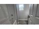 Updated bathroom with a tub and shower combination features modern fixtures and plank flooring at 4052 Keheley Glen Ne Dr, Marietta, GA 30066