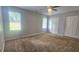 Bedroom featuring a ceiling fan, carpet, and double closets at 4052 Keheley Glen Ne Dr, Marietta, GA 30066