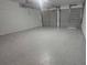 Spacious two-car garage features sealed concrete flooring and automatic doors at 4052 Keheley Glen Ne Dr, Marietta, GA 30066