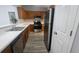 Kitchen features stainless steel appliances, wood cabinets and gray vinyl floors at 4052 Keheley Glen Ne Dr, Marietta, GA 30066