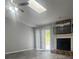 Bright living room with fireplace, skylight and sliding glass doors to patio at 4052 Keheley Glen Ne Dr, Marietta, GA 30066