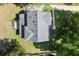 Aerial view of a well-maintained roof, wooden deck, and landscaping at 5150 Shadow Path Sw Ln, Lilburn, GA 30047