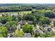 Aerial view of residential neighborhood with tree-lined streets and well-maintained homes at 5150 Shadow Path Sw Ln, Lilburn, GA 30047