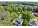 Aerial view of a home surrounded by mature trees at 5150 Shadow Path Sw Ln, Lilburn, GA 30047
