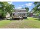 Expansive backyard featuring a charming deck, perfect for outdoor entertaining and relaxation at 5150 Shadow Path Sw Ln, Lilburn, GA 30047