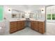Spacious bathroom with double sink vanity, quartz countertops, and modern lighting at 5150 Shadow Path Sw Ln, Lilburn, GA 30047