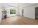 Bright and spacious bedroom with hardwood floors, recessed lighting, chandelier, and large window at 5150 Shadow Path Sw Ln, Lilburn, GA 30047
