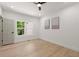 Bedroom with natural light, neutral paint, and hardwood floors at 5150 Shadow Path Sw Ln, Lilburn, GA 30047