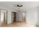 Spacious bedroom features hardwood floors, a ceiling fan, and access to a walk-in closet at 5150 Shadow Path Sw Ln, Lilburn, GA 30047
