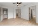 Spacious bedroom with hardwood floors, closet, and access to other rooms at 5150 Shadow Path Sw Ln, Lilburn, GA 30047
