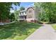 Charming home on a hill features a lush lawn, long driveway, and inviting curb appeal at 5150 Shadow Path Sw Ln, Lilburn, GA 30047