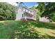 A beautifully designed two-story home with a charming porch and lush green lawn at 5150 Shadow Path Sw Ln, Lilburn, GA 30047