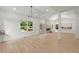 Spacious living room with fireplace, recessed lighting, vaulted ceiling, and large windows at 5150 Shadow Path Sw Ln, Lilburn, GA 30047