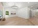 Bright living room featuring a decorative fireplace, modern lighting, recessed lights, and hardwood floors at 5150 Shadow Path Sw Ln, Lilburn, GA 30047