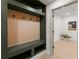 Functional mudroom with built-in bench, storage cubbies, and coat hooks at 5150 Shadow Path Sw Ln, Lilburn, GA 30047