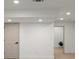 A room with light wood flooring and an doorway to another room with a plant at 5150 Shadow Path Sw Ln, Lilburn, GA 30047