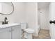 Bright bathroom with modern vanity, round mirror, and a shower/tub combination at 683 Highland Ct, Marietta, GA 30068
