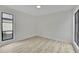 This bedroom has light floors and a large black framed window to let in plenty of light at 683 Highland Ct, Marietta, GA 30068