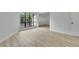 Bedroom with light floors, a large black framed window and neutral color palette at 683 Highland Ct, Marietta, GA 30068