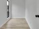 Hallway with updated flooring, black door hardware, and a light color palette at 683 Highland Ct, Marietta, GA 30068