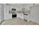 Updated kitchen featuring white cabinets, stainless steel appliances, and modern fixtures at 683 Highland Ct, Marietta, GA 30068