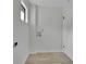 Laundry room with a window, light floors, and hookups for a washer and dryer at 683 Highland Ct, Marietta, GA 30068