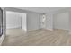 Spacious open floor plan with wood-look laminate flooring and light-colored walls at 683 Highland Ct, Marietta, GA 30068