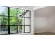 Living room features modern light vinyl floors, white walls and large black-framed window at 683 Highland Ct, Marietta, GA 30068