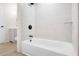 Bright shower and tub combination with white subway tile and modern, black fixtures at 683 Highland Ct, Marietta, GA 30068