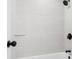Shower featuring gray horizontal tiles with black hardware, faucet, and shower head at 683 Highland Ct, Marietta, GA 30068