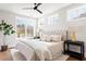 A bright bedroom featuring a large window and neutral decor at 7130 Summit Pl, Alpharetta, GA 30009