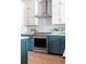 Well-equipped kitchen showcasing stainless steel appliances, a tile backsplash, and wood flooring at 7130 Summit Pl, Alpharetta, GA 30009