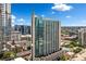 High-rise building with a pool in a bustling city neighborhood on a sunny day at 860 Peachtree Ne St # 1513, Atlanta, GA 30308