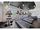 Fully equipped fitness center with treadmills, exercise bike, and elliptical machines overlooking the city at 860 Peachtree Ne St # 1513, Atlanta, GA 30308