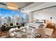 Bright living area features a comfortable bedroom and floor-to-ceiling windows with city views at 860 Peachtree Ne St # 1513, Atlanta, GA 30308