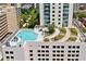 Aerial view of a rooftop pool, landscaping, and lounge area providing an exclusive amenity for residents at 860 Peachtree Ne St # 1513, Atlanta, GA 30308