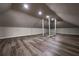 Well-lit attic with modern flooring, gray accents, and built-in access at 1029 Katherwood Sw Dr, Atlanta, GA 30310