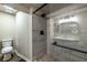 Modern bathroom with tiled shower, glass enclosure and updated vanity at 1029 Katherwood Sw Dr, Atlanta, GA 30310