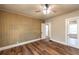 Bedroom featuring unique wallpaper, wood-look floors, a ceiling fan and natural light at 1029 Katherwood Sw Dr, Atlanta, GA 30310